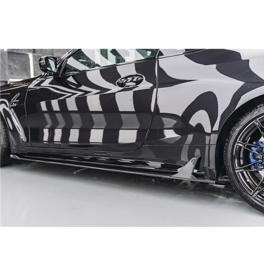 BMW M4 G82 OEM Style Carbon Fibre Side Skirt Extensions — front three-quarter view